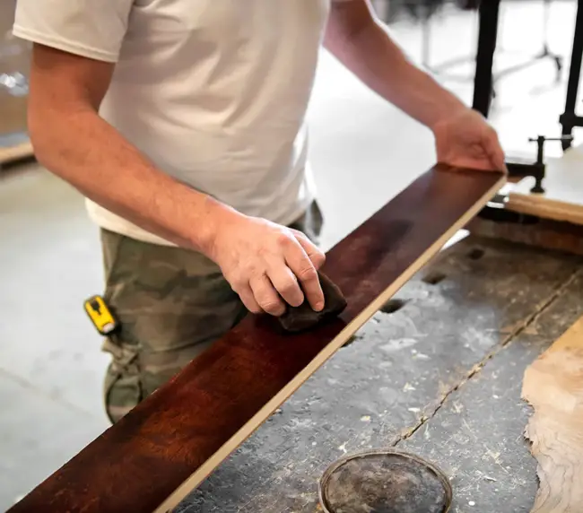 carpenter-or-woodworker-staining-briar-root-sheet