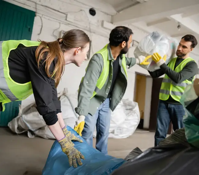 young-female-worker-in-protective-vest-and-gloves