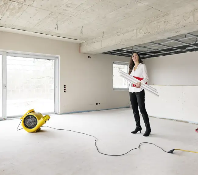 woman-in-empty-apartment-looking-around